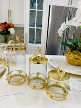 Load image into Gallery viewer, Glass and Gold Canister With Leaf Design