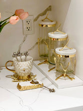 Load image into Gallery viewer, Glass Canister On Gold Twig Base with White Marble Cover